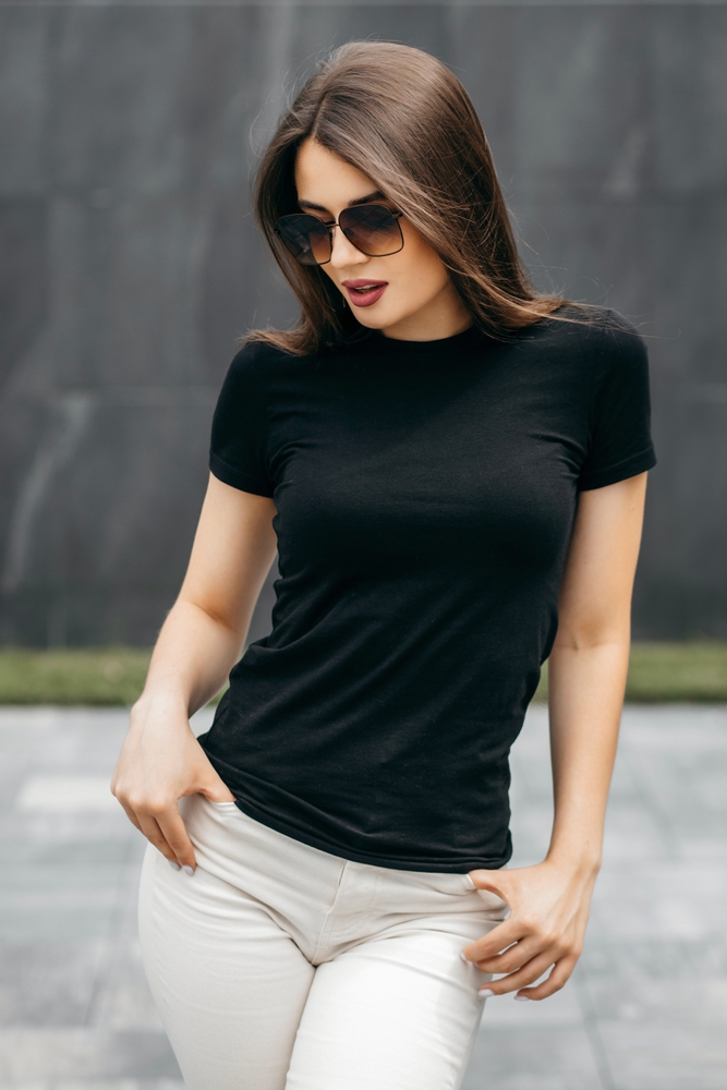 stylish,brunette,girl,wearing,black,t shirt,and,glasses,posing,against